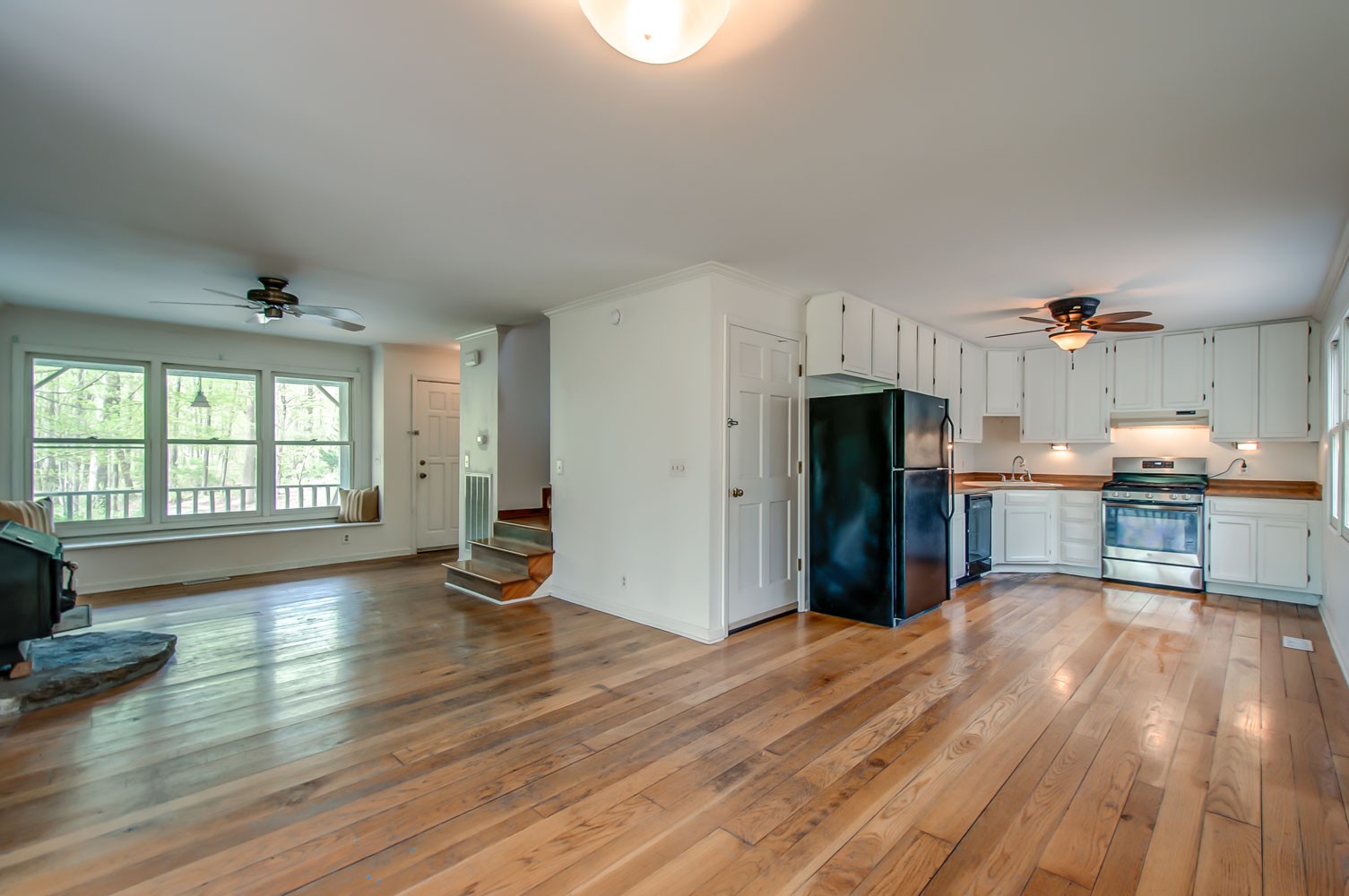 1136 Dora Whitley Road Franklin, TN 37064 - Photo 11 of 37 a view of a kitchen with wooden floor and a refrigerator