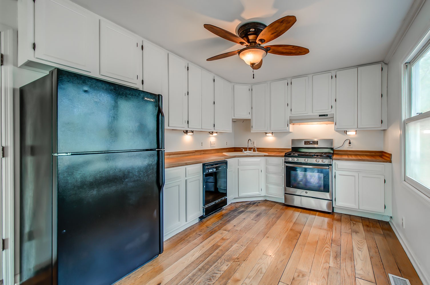 1136 Dora Whitley Road Franklin, TN 37064 - Photo 13 of 37 a kitchen with a refrigerator sink and cabinets