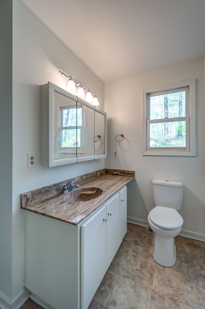 1136 Dora Whitley Road Franklin, TN 37064 - Photo 19 of 37 a bathroom with a granite countertop sink and a mirror