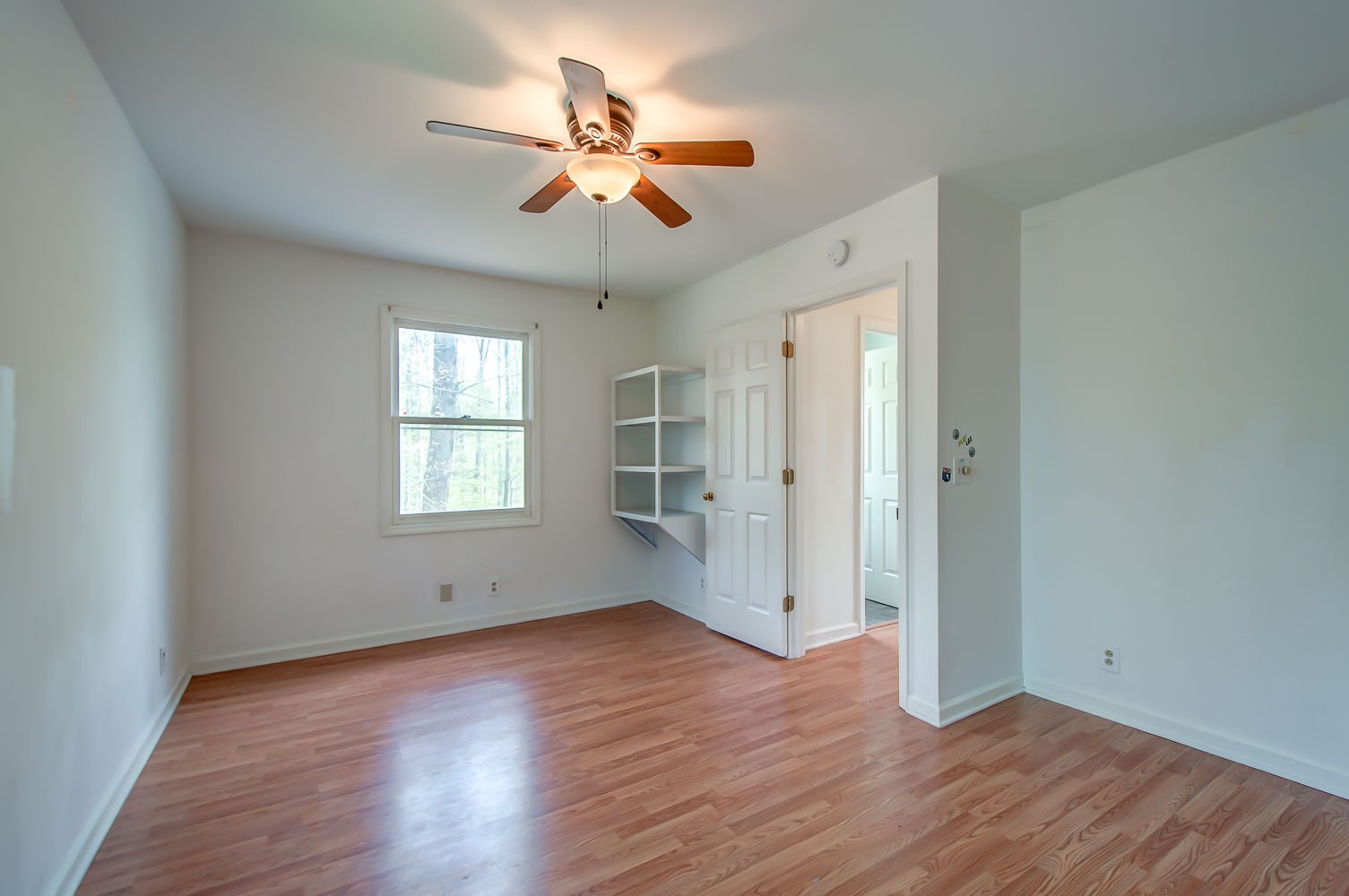 1136 Dora Whitley Road Franklin, TN 37064 - Photo 27 of 37 a view of an empty room with wooden floor and a window