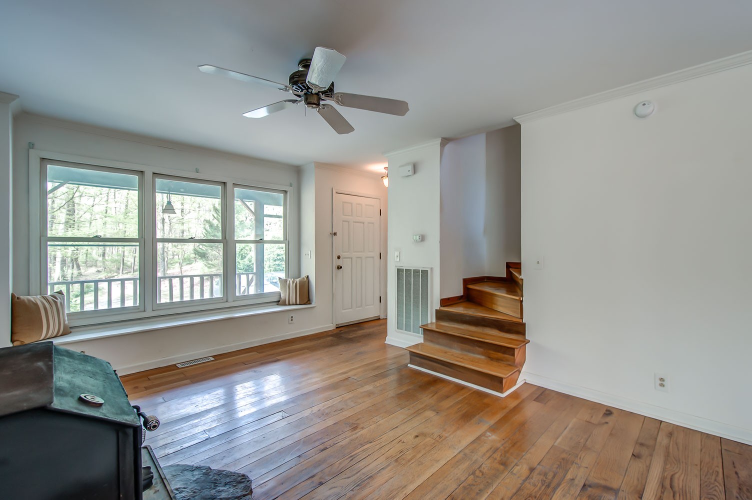 1136 Dora Whitley Road Franklin, TN 37064 - Photo 5 of 37 a view of an empty room with wooden floor and a window
