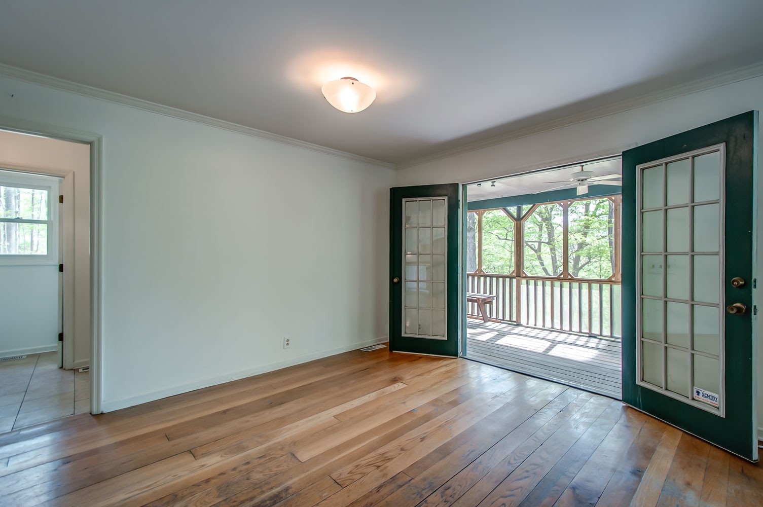 1136 Dora Whitley Road Franklin, TN 37064 - Photo 10 of 37 a view of an empty room with wooden floor and a window