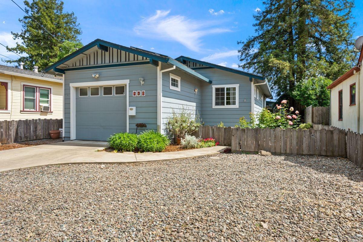 628 Mill Street Santa Rosa, CA 95404 - Photo 1 of 1 a front view of a house with a yard and potted plants