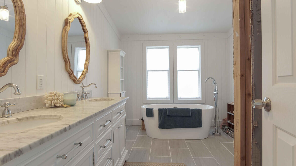 119 Edgewood Terrace Santa Rosa Beach, FL 32459 - Photo 11 of 23 a bathroom with a double vanity sink mirror and a bathtub
