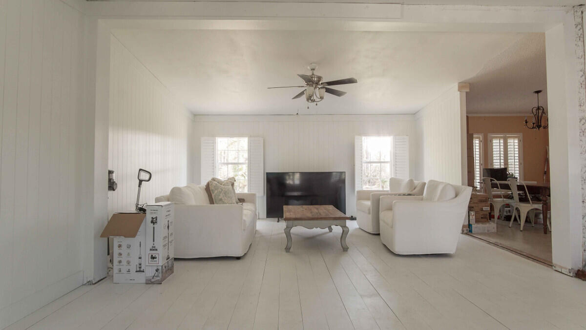 119 Edgewood Terrace Santa Rosa Beach, FL 32459 - Photo 12 of 23 a living room with furniture and a flat screen tv
