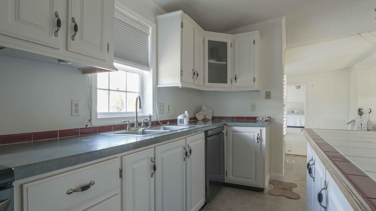 119 Edgewood Terrace Santa Rosa Beach, FL 32459 - Photo 4 of 23 a kitchen with a sink stove and cabinets