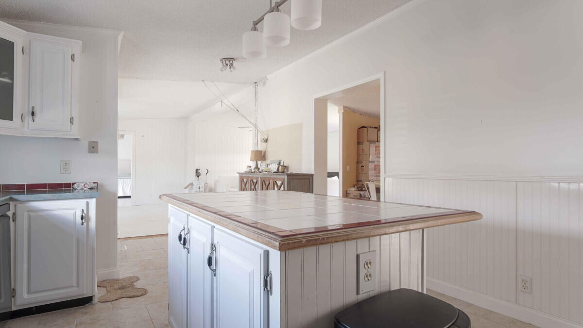119 Edgewood Terrace Santa Rosa Beach, FL 32459 - Photo 6 of 23 a kitchen with stainless steel appliances a sink and a refrigerator
