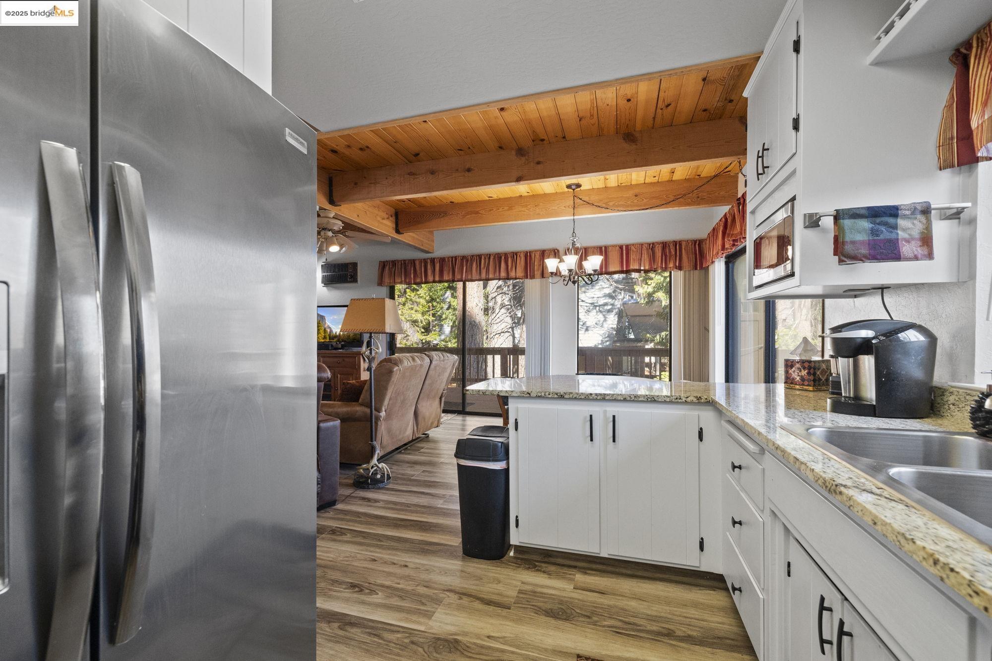 29803 West Mono Road Cold Springs, CA 95335 - Photo 11 of 51 a kitchen with stainless steel appliances granite countertop a refrigerator and a sink