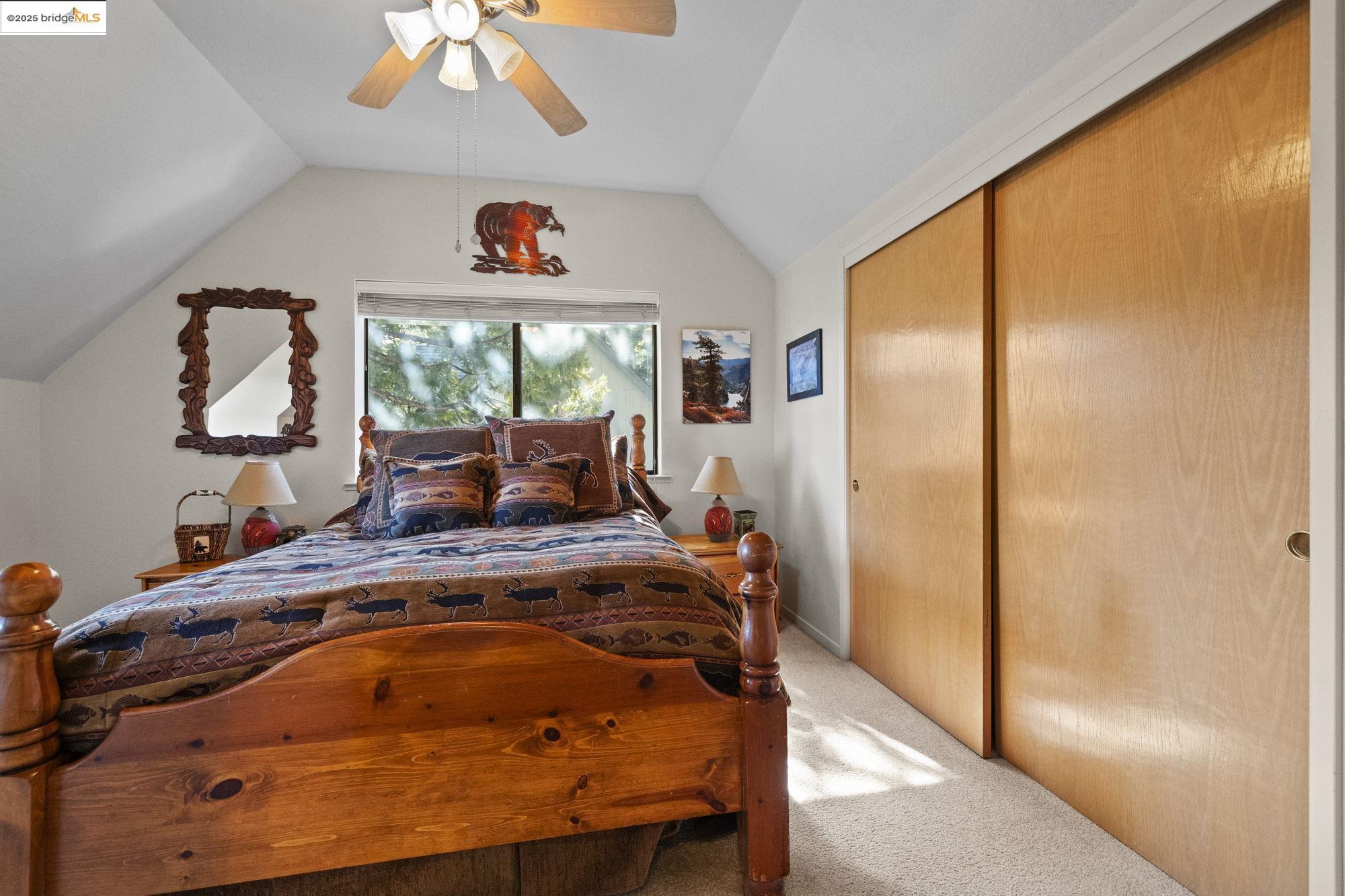 29803 West Mono Road Cold Springs, CA 95335 - Photo 17 of 51 a bed sitting in a bedroom next to a window