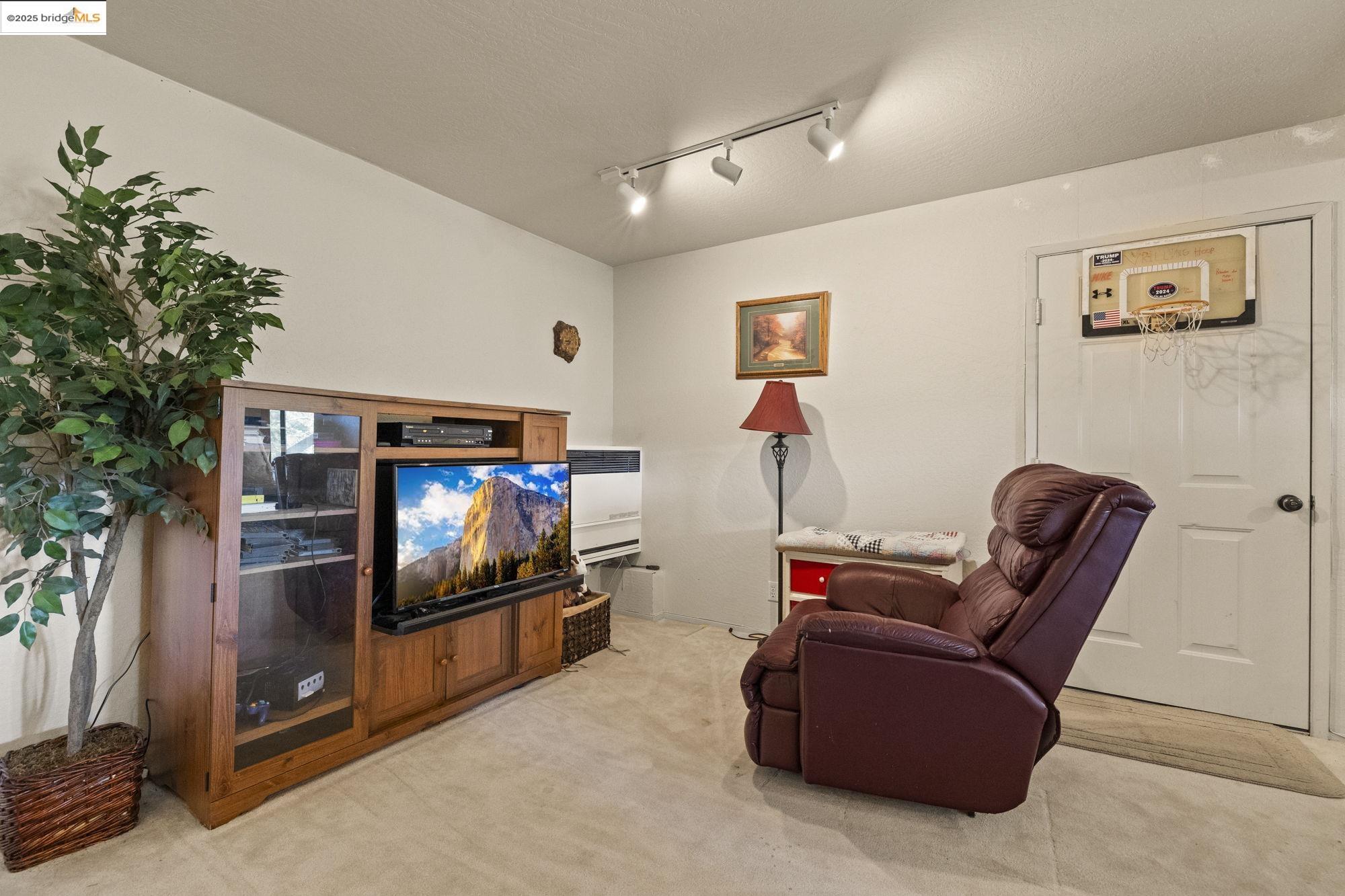 29803 West Mono Road Cold Springs, CA 95335 - Photo 32 of 51 a living room with furniture and a flat screen tv