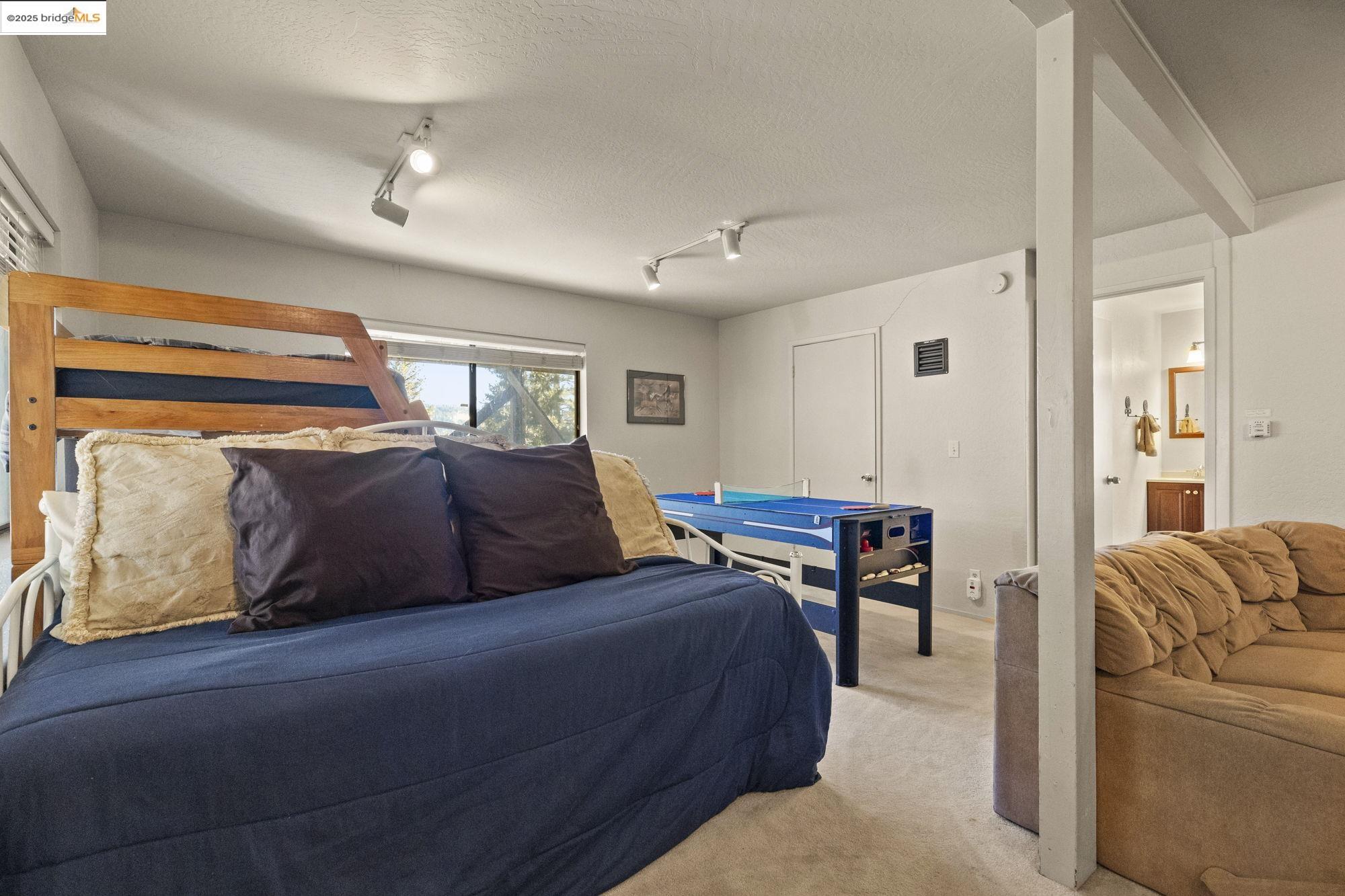 29803 West Mono Road Cold Springs, CA 95335 - Photo 33 of 51 a living room with furniture a ceiling fan and a rug