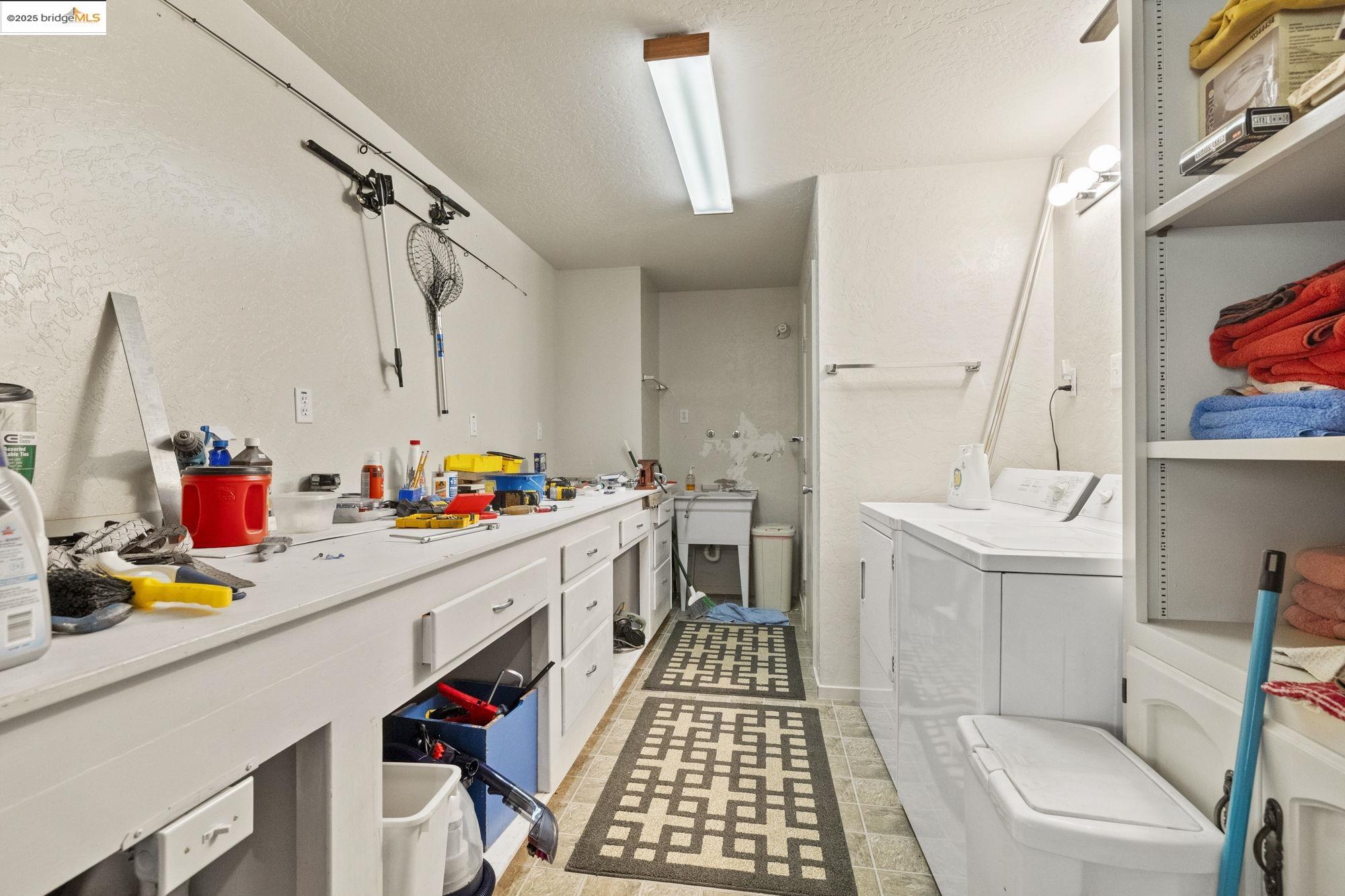29803 West Mono Road Cold Springs, CA 95335 - Photo 35 of 51 a storage room with a sink and wooden floor
