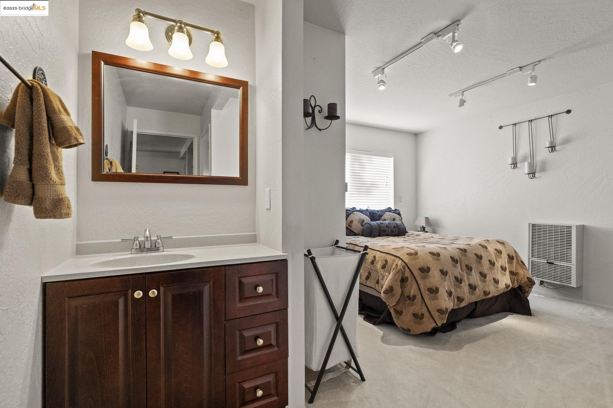 29803 West Mono Road Cold Springs, CA 95335 - Photo 36 of 51 a bedroom with a bed and a mirror on dresser