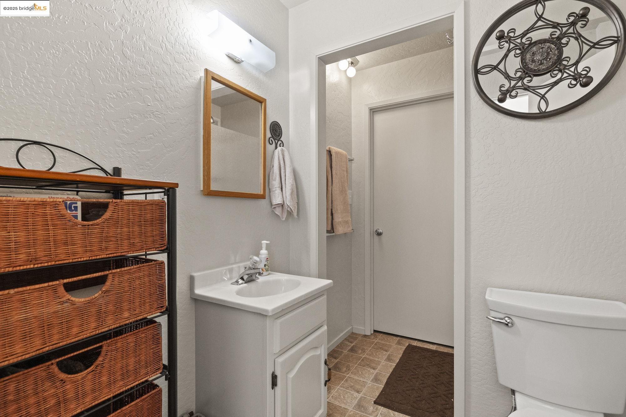 29803 West Mono Road Cold Springs, CA 95335 - Photo 38 of 51 a bathroom with a toilet sink and mirror