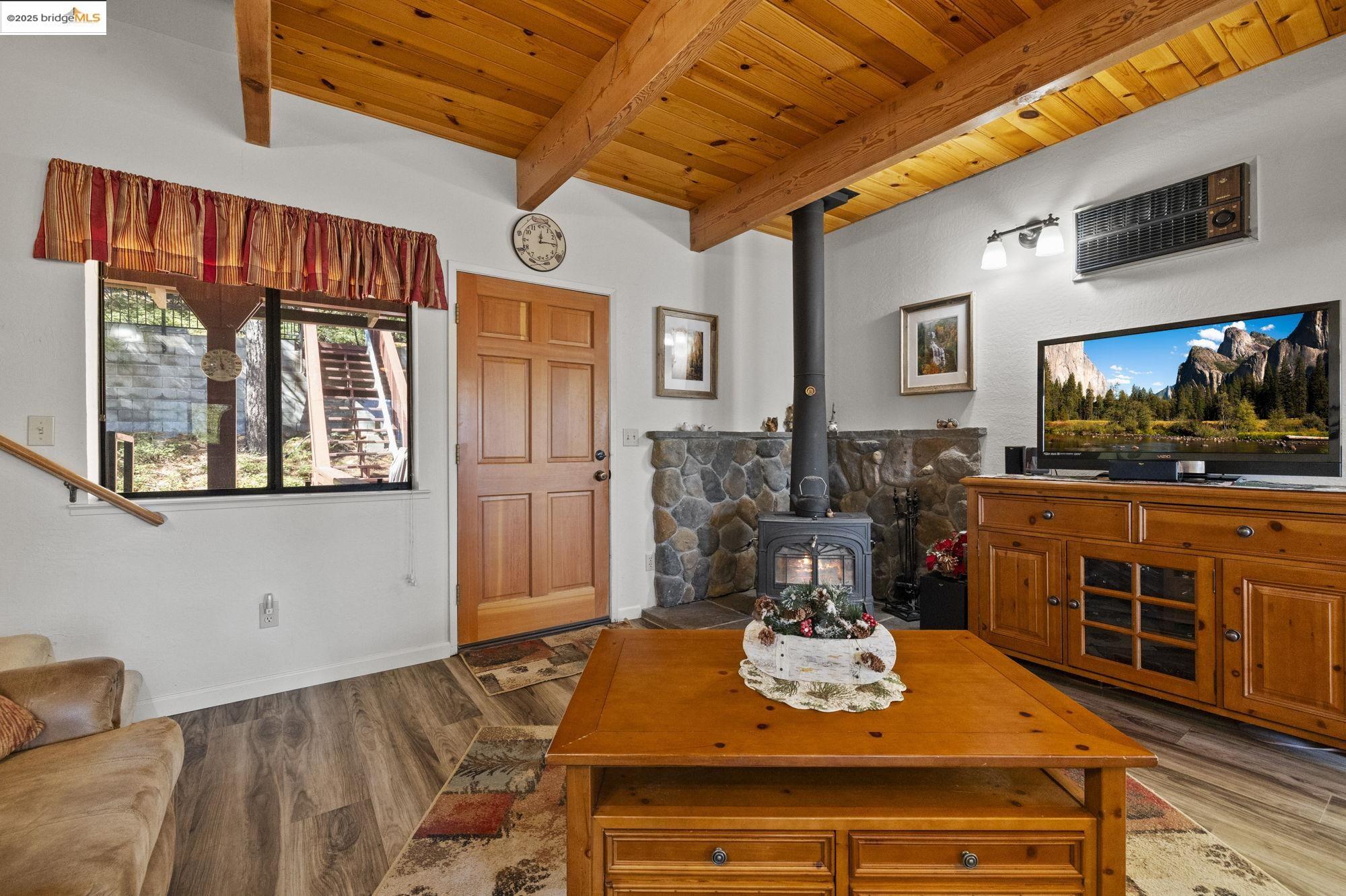 29803 West Mono Road Cold Springs, CA 95335 - Photo 4 of 51 a view of a dining room with furniture window and wooden floor