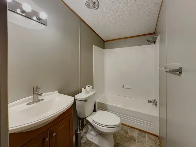 an empty room with a empty space and windows