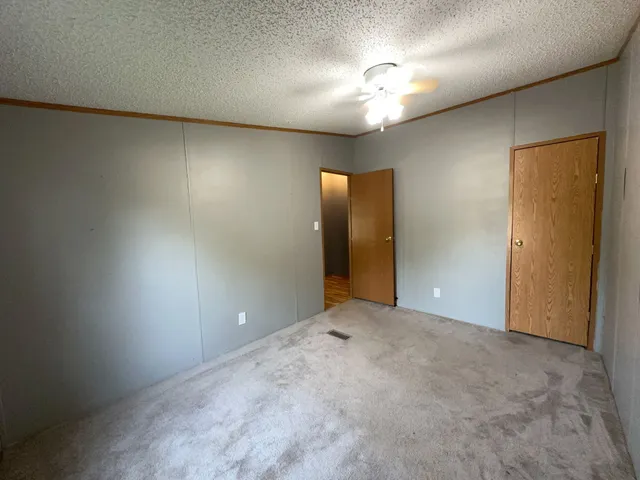 an empty room with a wooden door