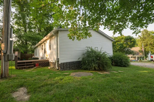 a view of a house with a yard porch and sitting area