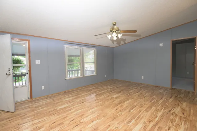 a view of a livingroom with a kitchen