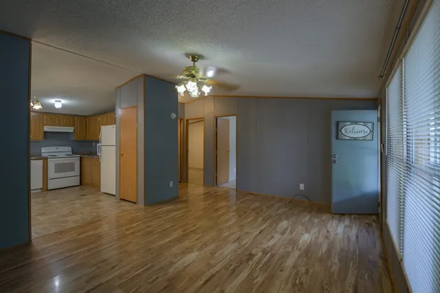 a kitchen with a refrigerator a stove top oven a sink and dishwasher