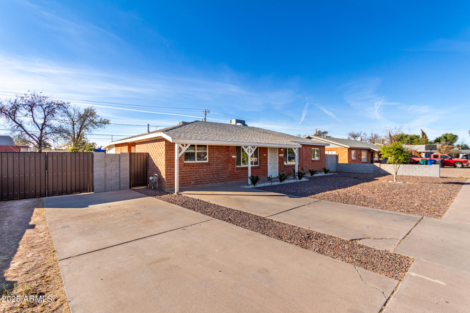 1061 West 5th Street Mesa, AZ 85201 - Photo 2 of 29 a front view of a house with a yard