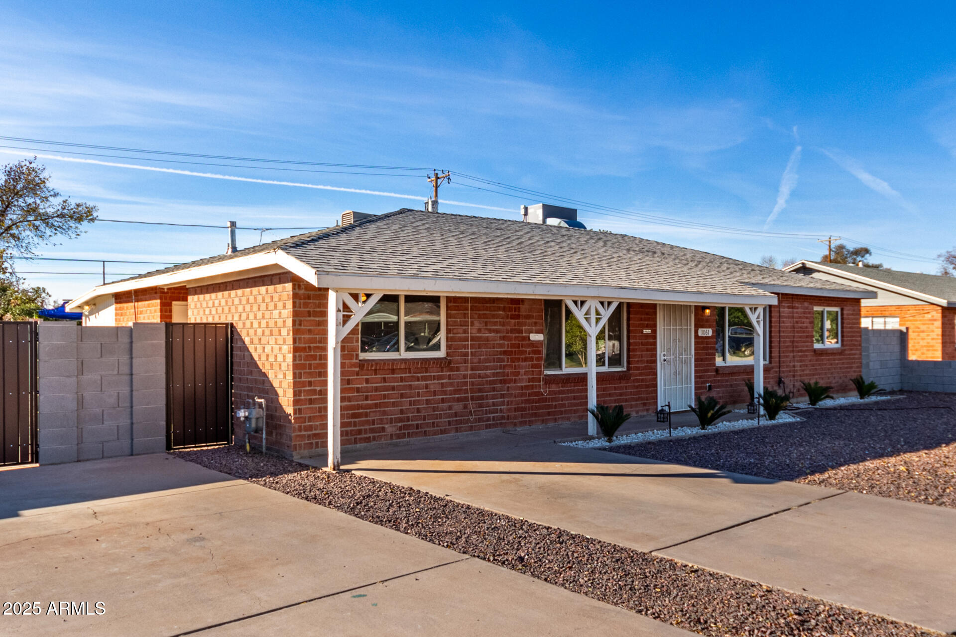 1061 West 5th Street Mesa, AZ 85201 - Photo 27 of 29 a front view of a house with a yard