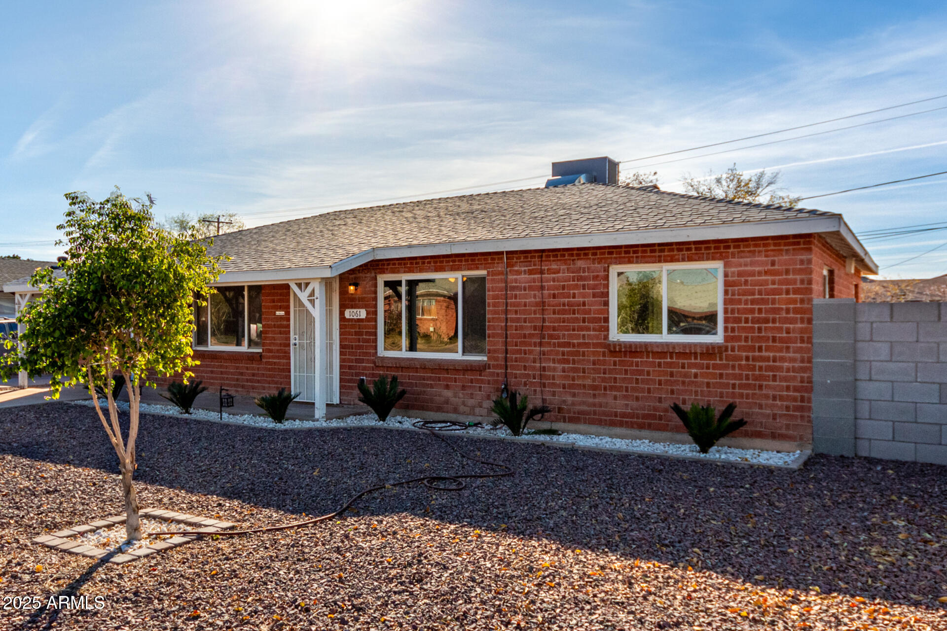 1061 West 5th Street Mesa, AZ 85201 - Photo 29 of 29 a front view of a house with garden