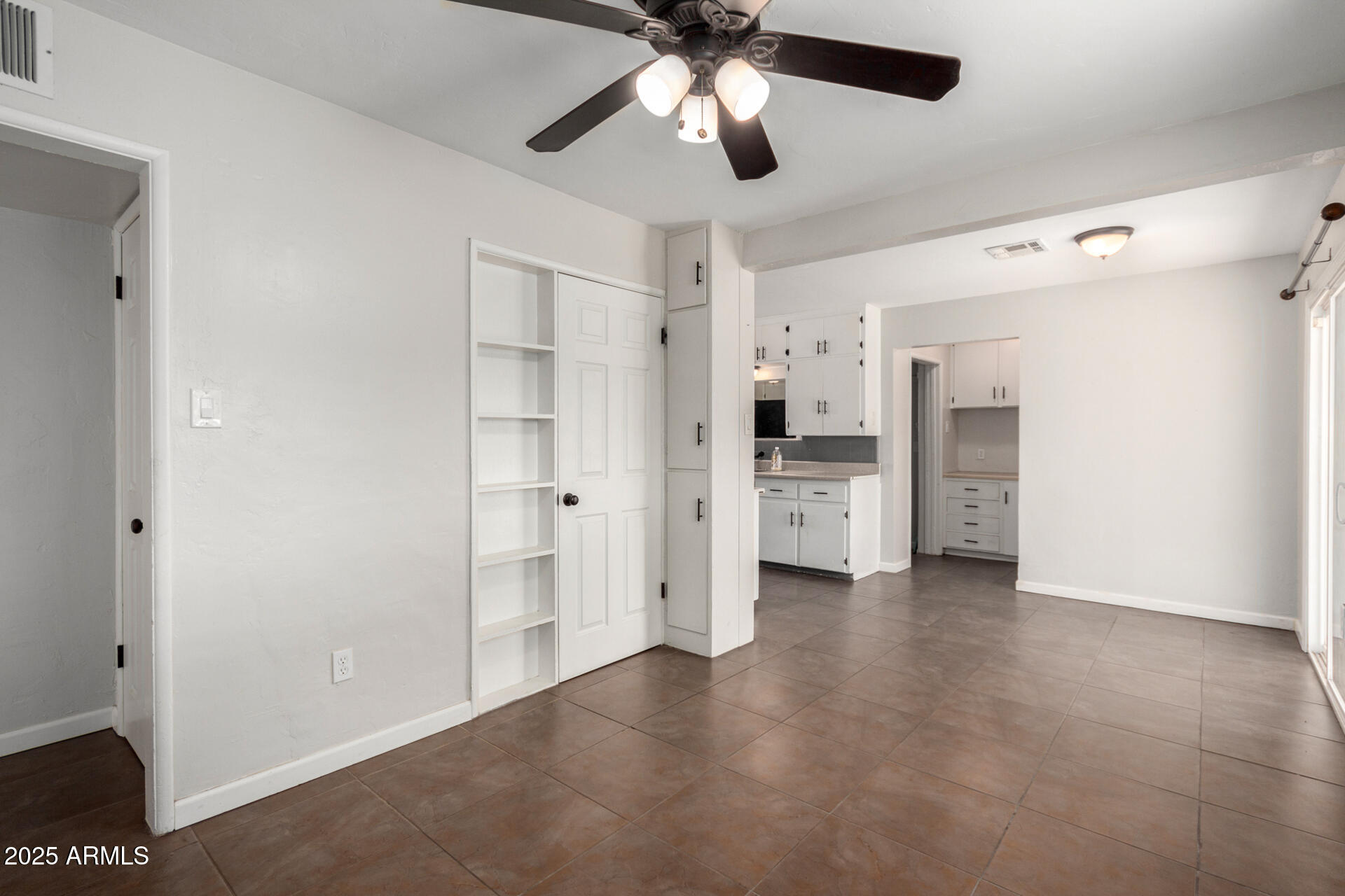1061 West 5th Street Mesa, AZ 85201 - Photo 9 of 29 a view of a kitchen with refrigerator and an empty room