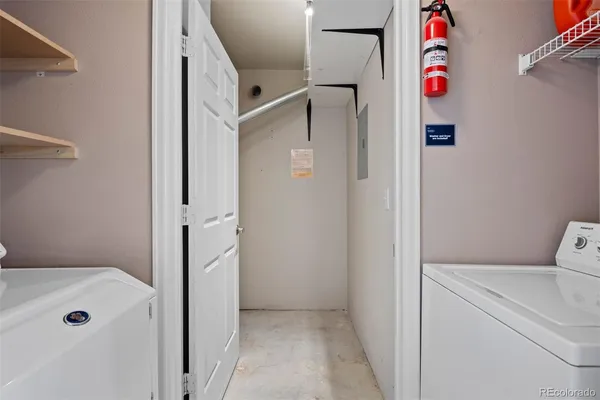 a kitchen with stainless steel appliances a refrigerator stove and microwave