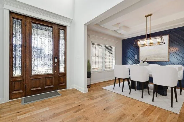 a view of a dining room with furniture window and wooden floor