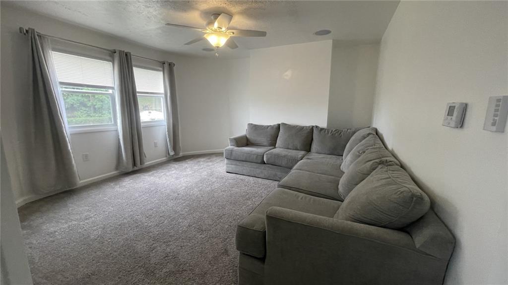 115 Lacock Avenue Rochester, PA 15074 - Photo 6 of 23 a living room with furniture and a window