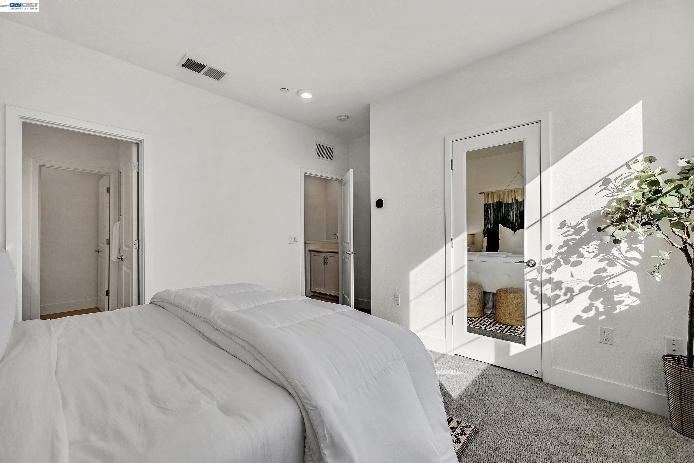 29259 Hub Court Hayward, CA 94544 - Photo 15 of 34 a bedroom with a large bed and a chandelier