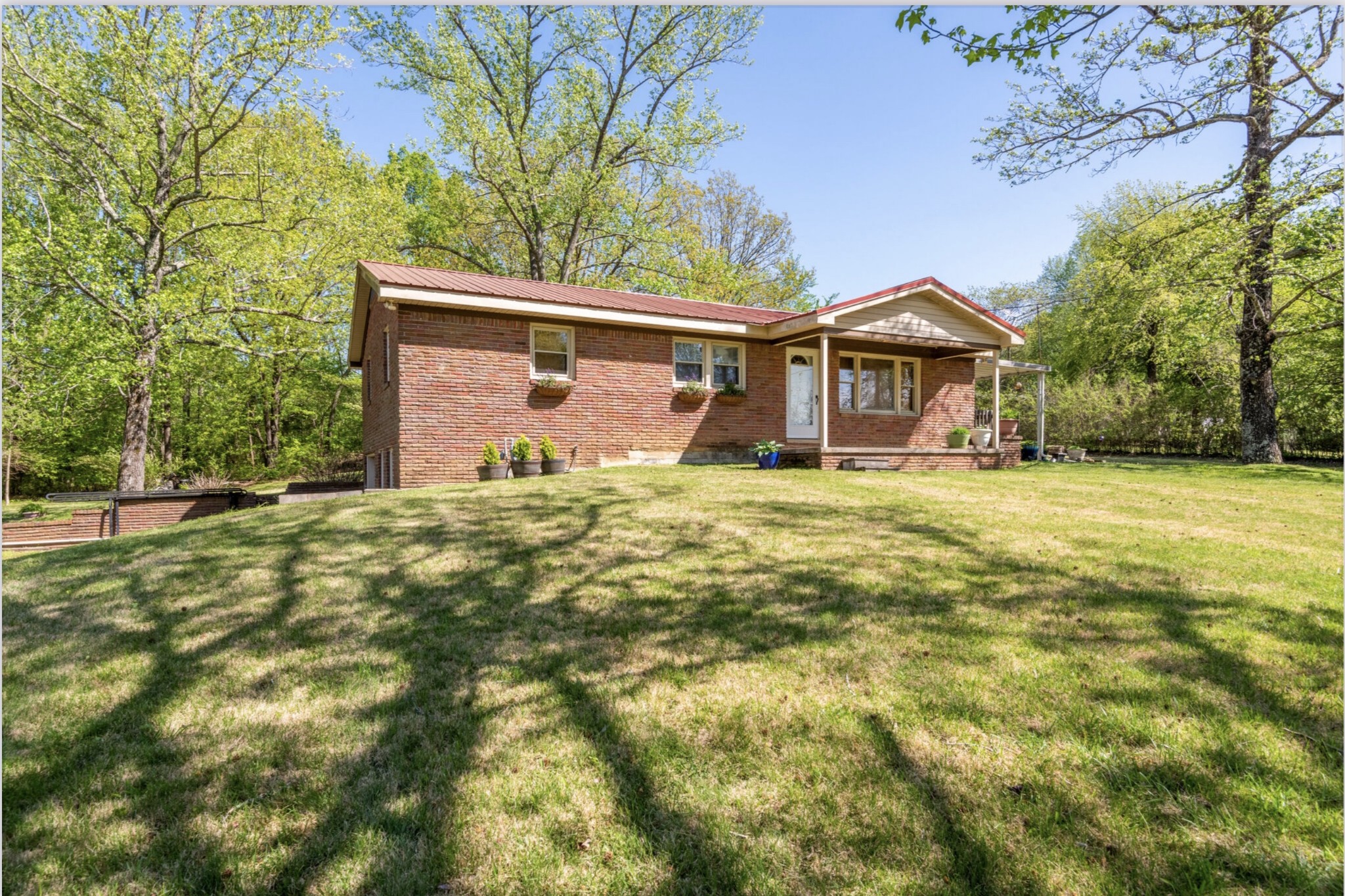 1784 New Dry Hollow Road Vanleer, TN 37181 - Photo 2 of 4 a view of a house with a yard