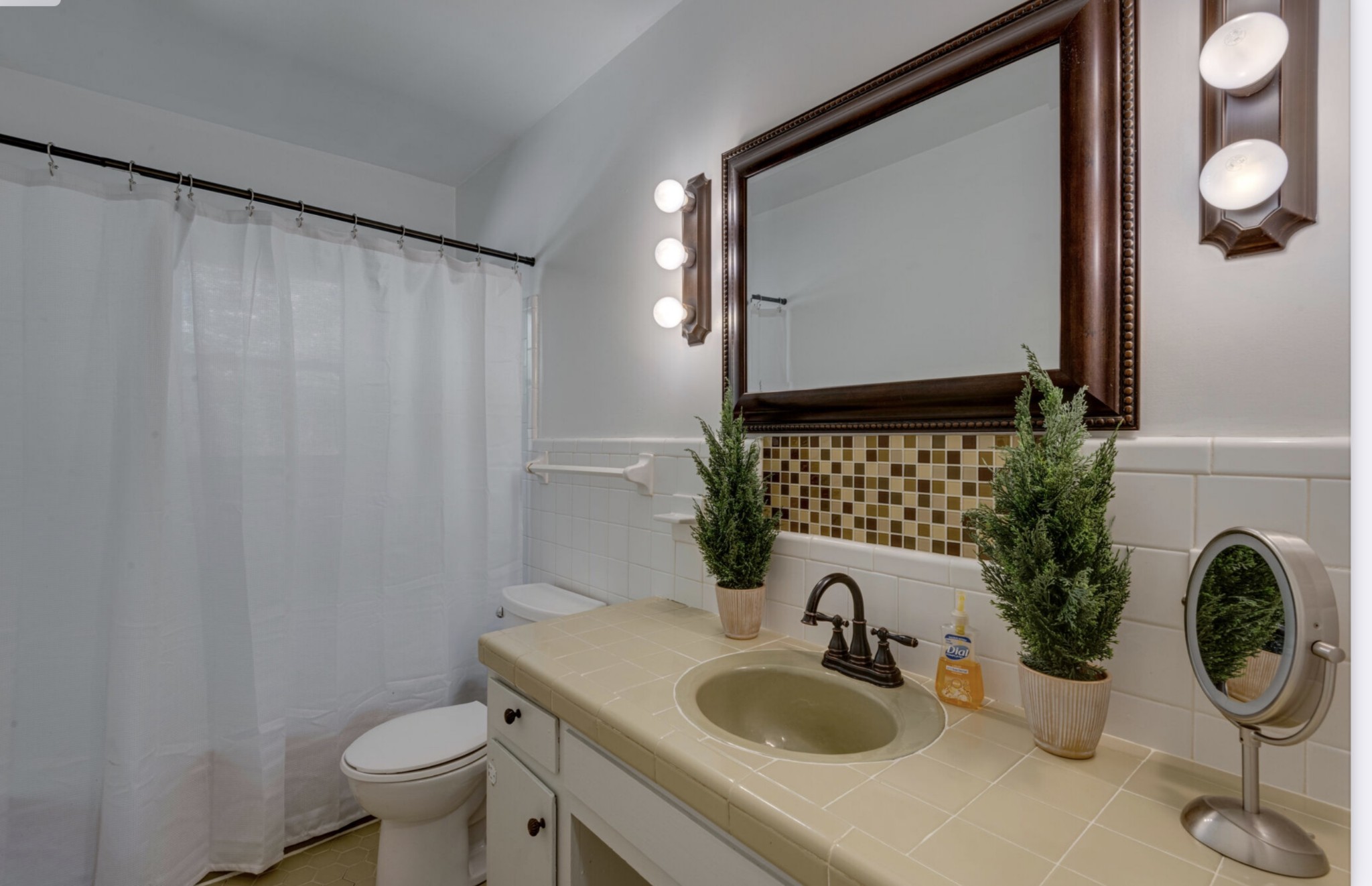 1784 New Dry Hollow Road Vanleer, TN 37181 - Photo 3 of 4 a bathroom with a toilet sink and mirror
