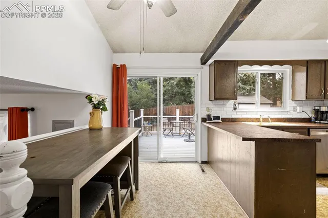 a kitchen with a counter space a sink appliances and a counter top space