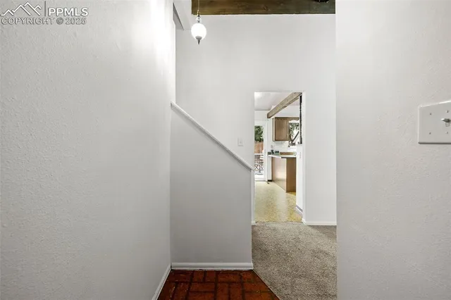 a view of a hallway with staircase