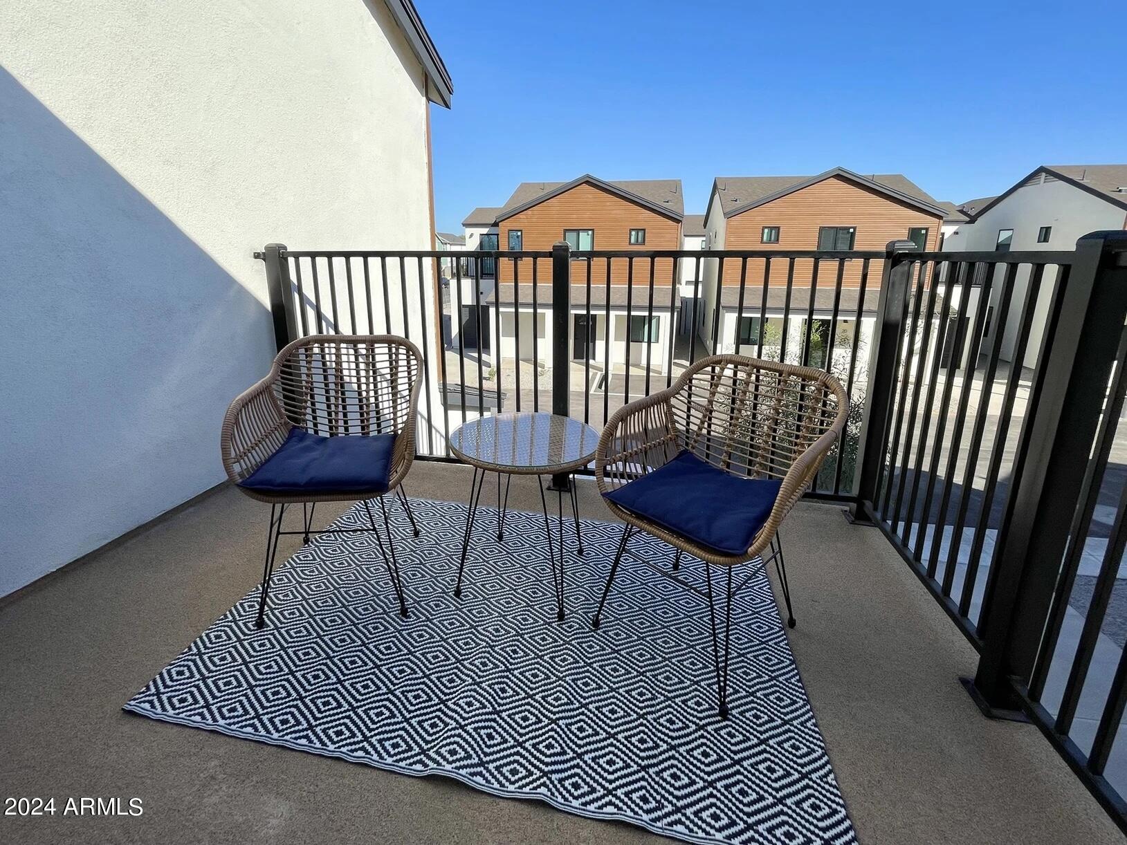 815 East Roma Avenue, Unit 5 Phoenix, AZ 85014 - Photo 12 of 28 a view of a chairs and table on the deck