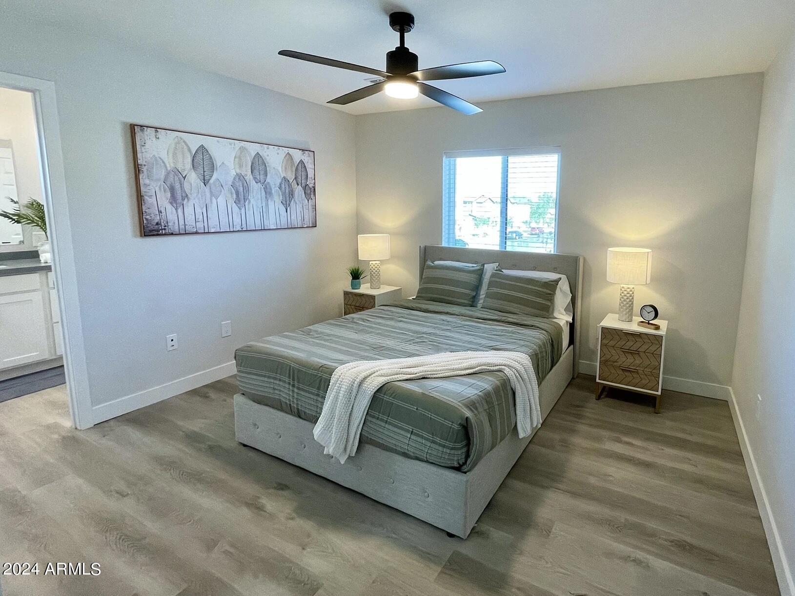 815 East Roma Avenue, Unit 5 Phoenix, AZ 85014 - Photo 15 of 28 a bedroom with a bed and a window