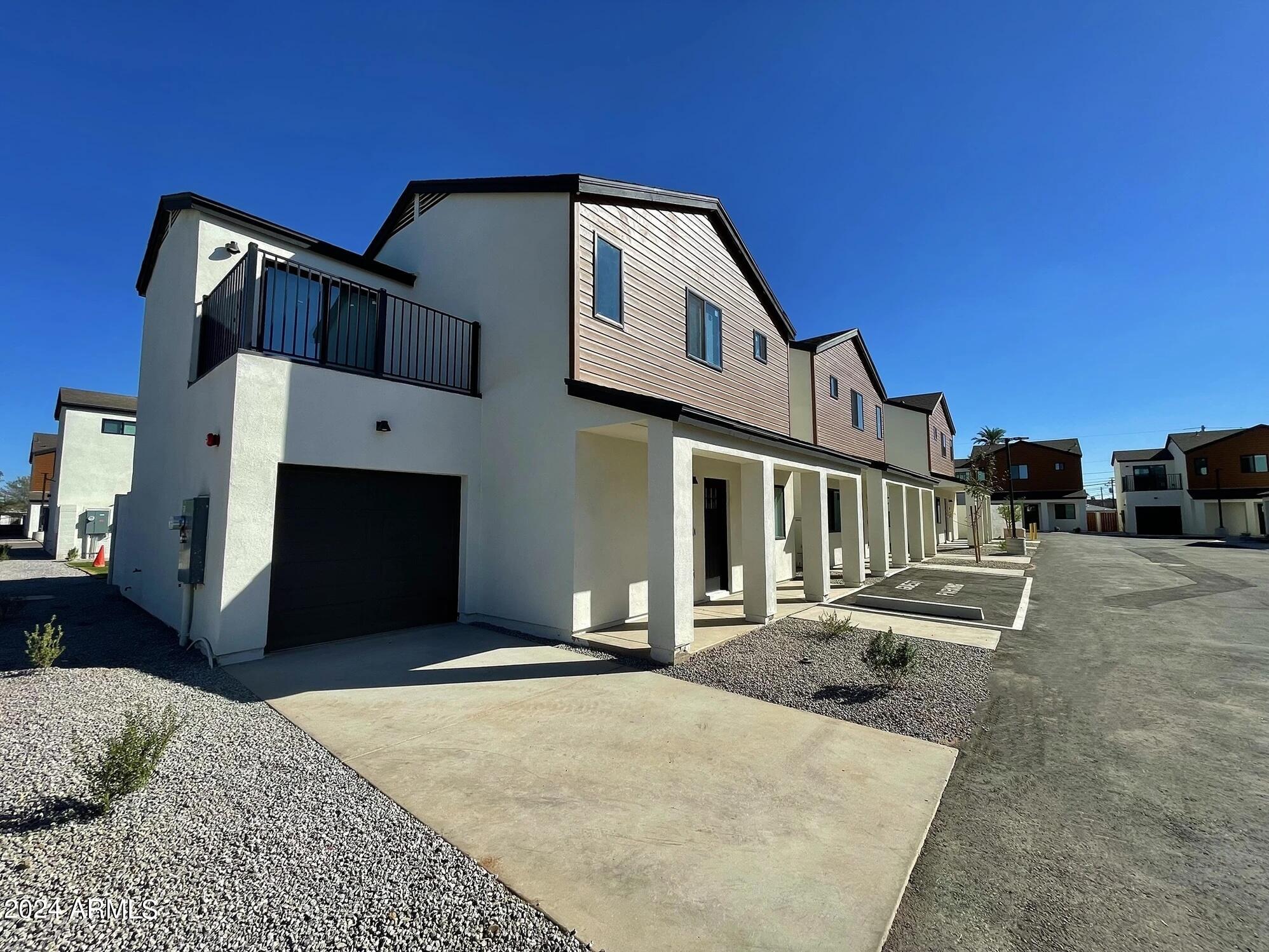 815 East Roma Avenue, Unit 5 Phoenix, AZ 85014 - Photo 21 of 28 a front view of a house with a yard