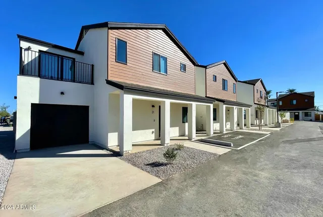 a front view of a house with a garage