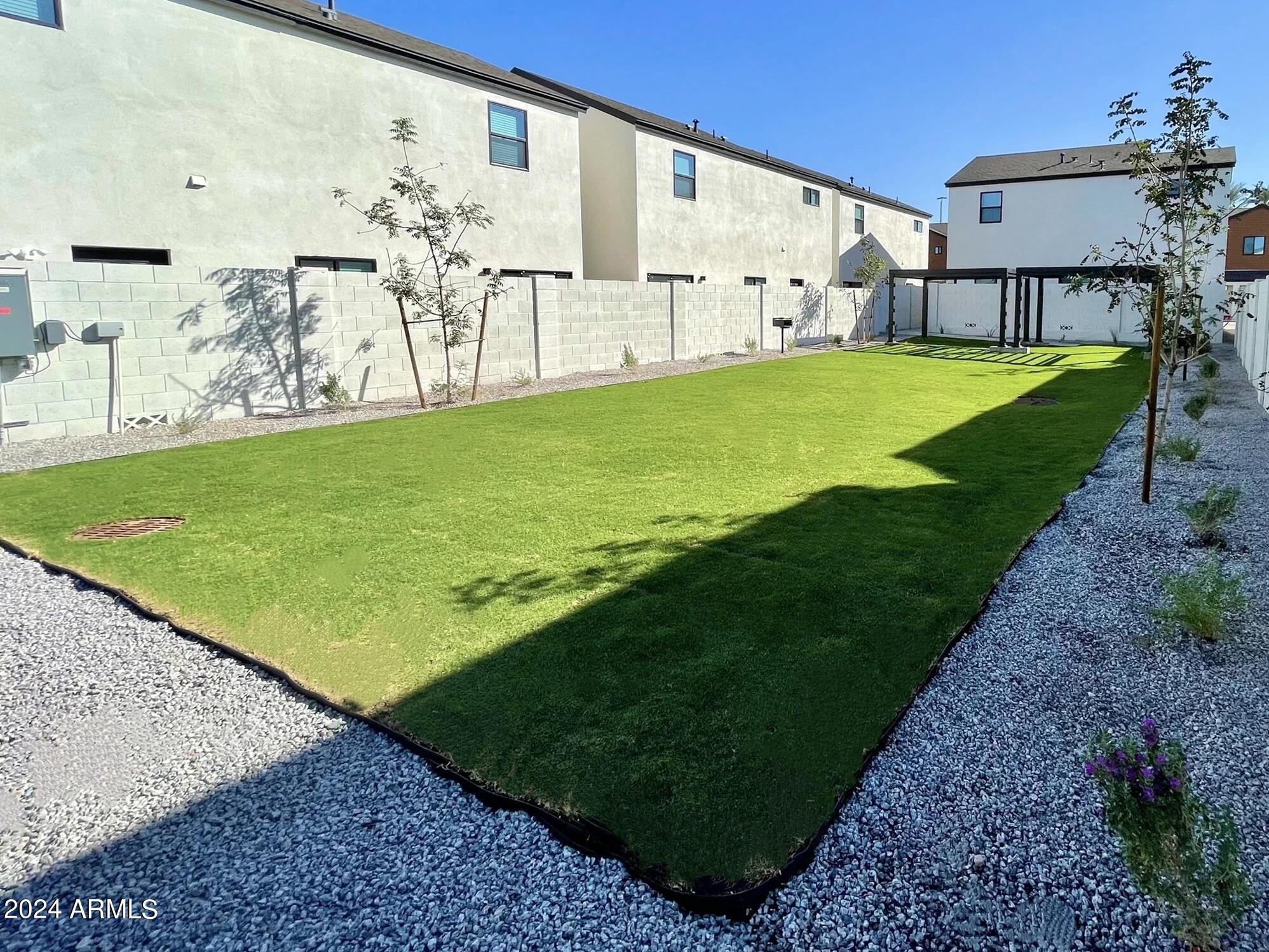 815 East Roma Avenue, Unit 5 Phoenix, AZ 85014 - Photo 25 of 28 a view of a backyard with sitting area