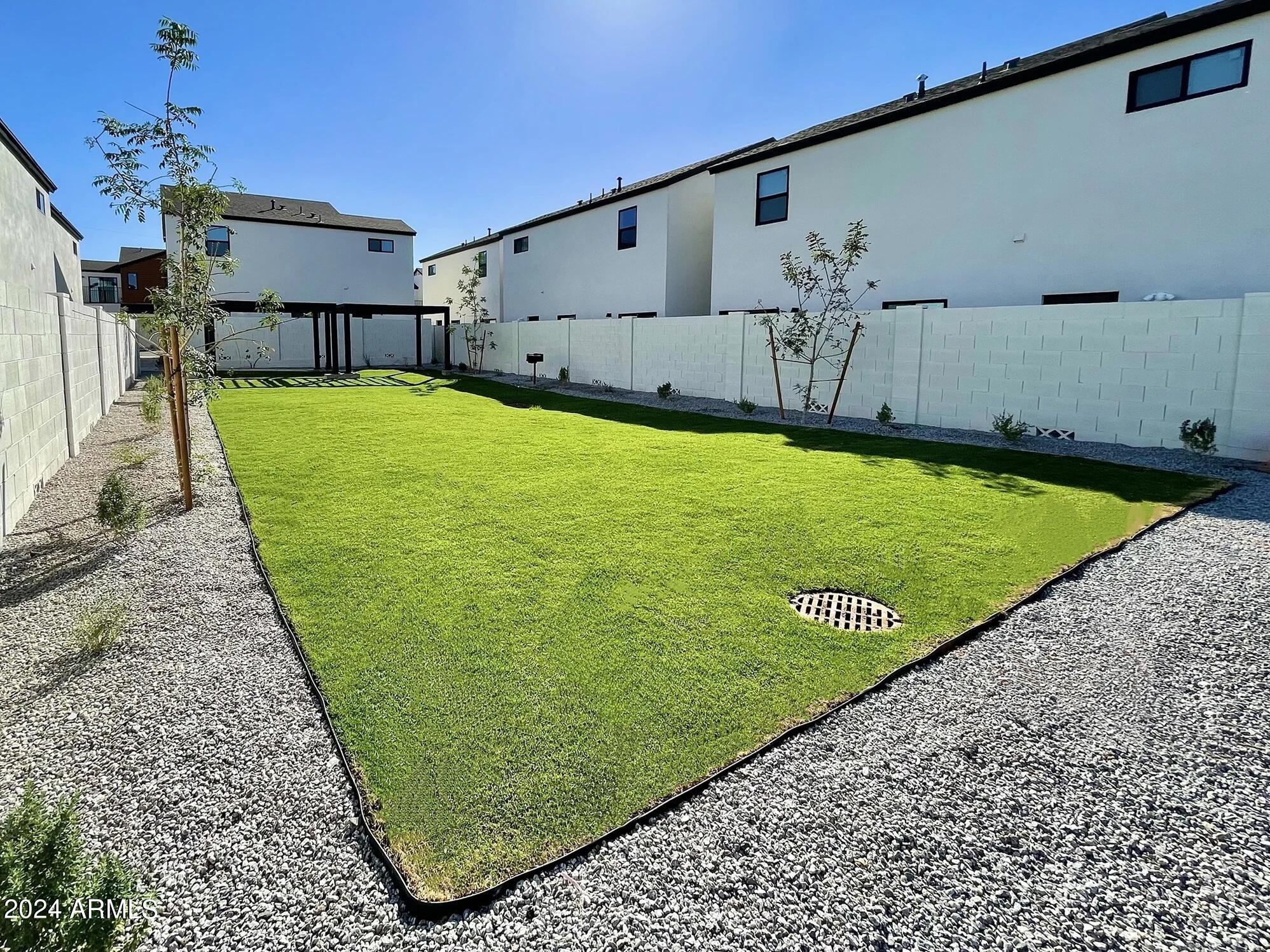 815 East Roma Avenue, Unit 5 Phoenix, AZ 85014 - Photo 26 of 28 a view of a back yard with a swimming pool