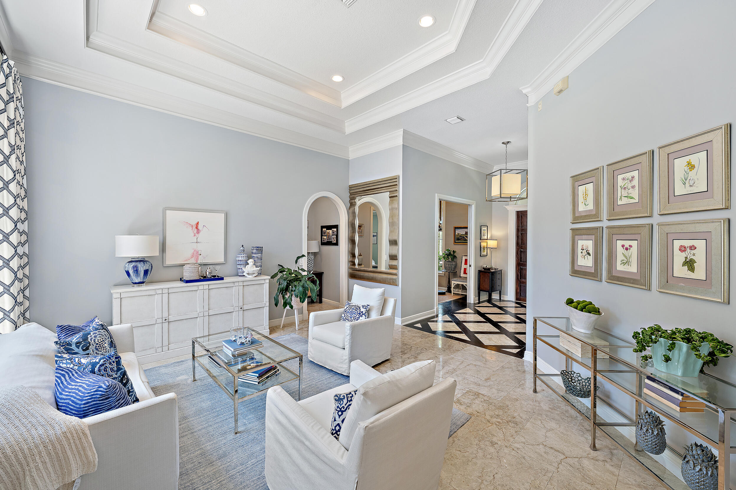 105 Segovia Way Jupiter, FL 33458 - Photo 5 of 33 a living room with furniture and flowers