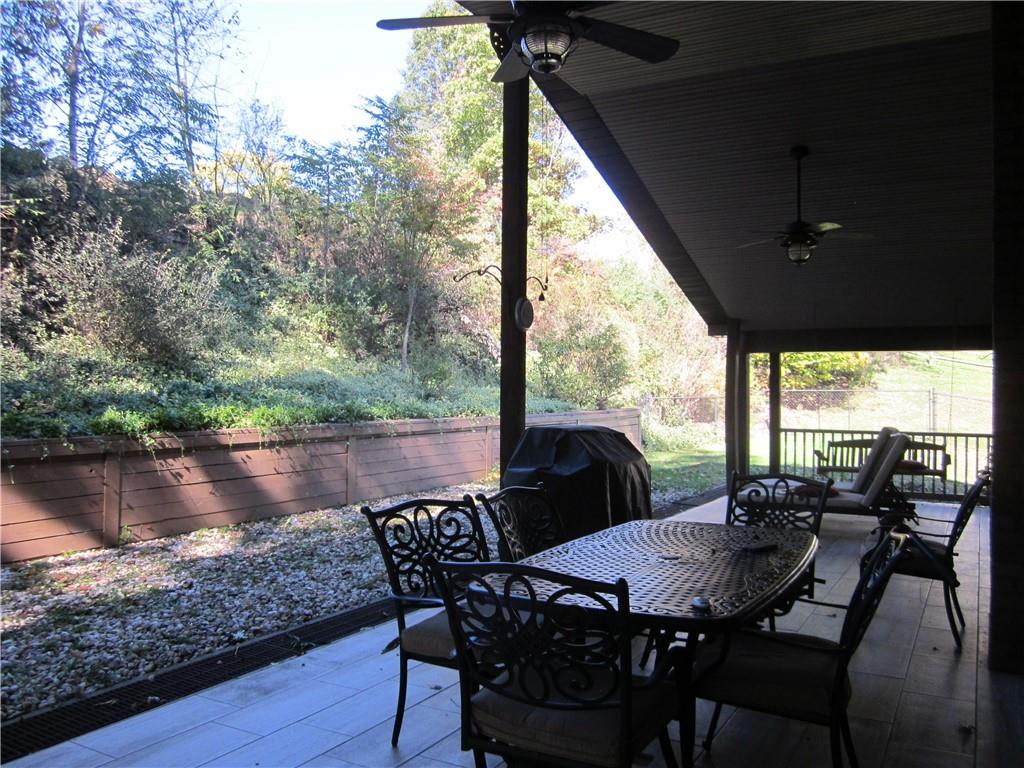 3313 Garvers Ferry Road Lower Burrell, PA 15068 - Photo 17 of 38 ceramic tiled flooring outside on 44'covered patio!