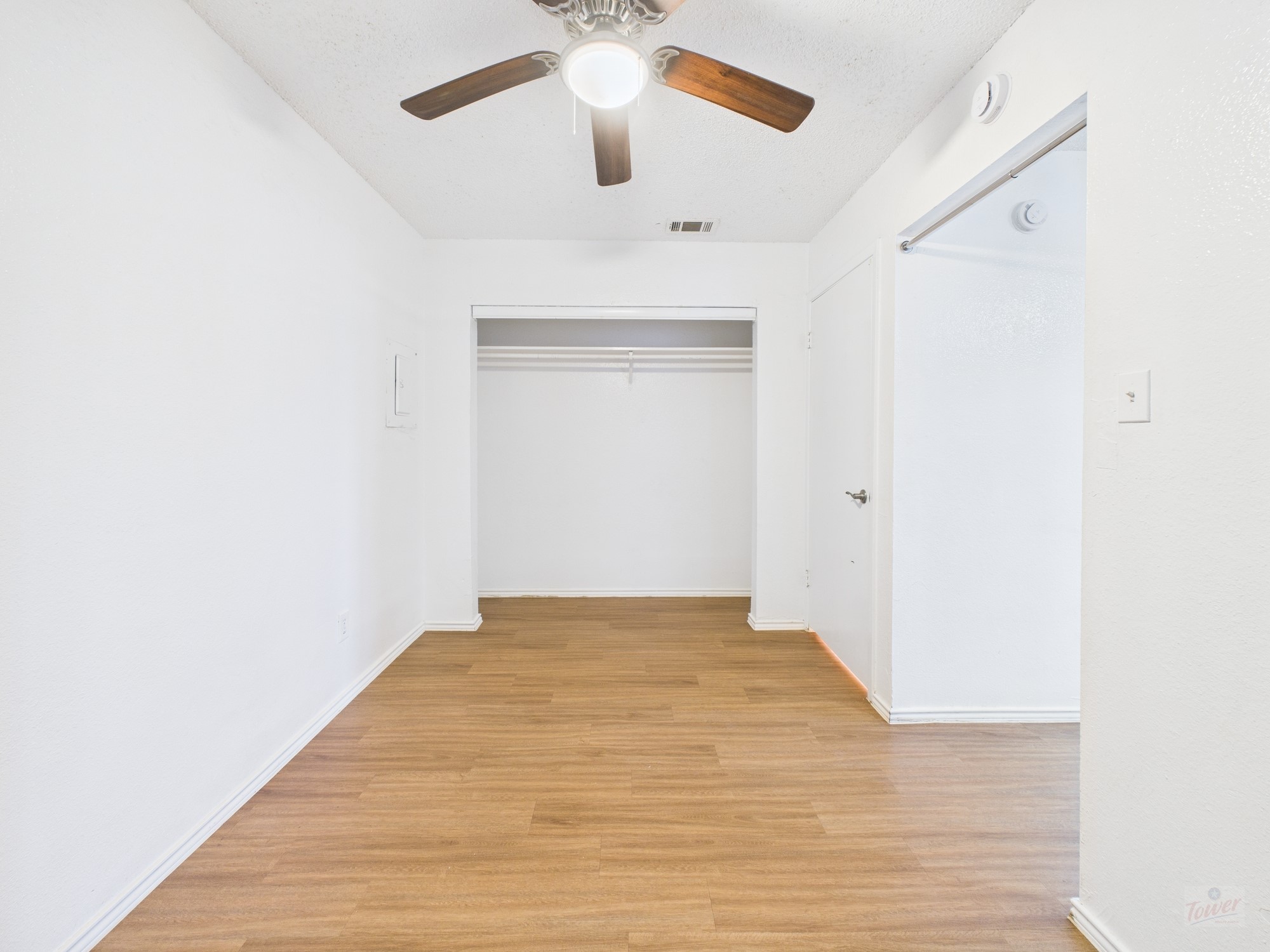 2500 Burleson Road, Unit 201 Austin, TX 78741 - Photo 13 of 20 a view of an empty room with wooden floor
