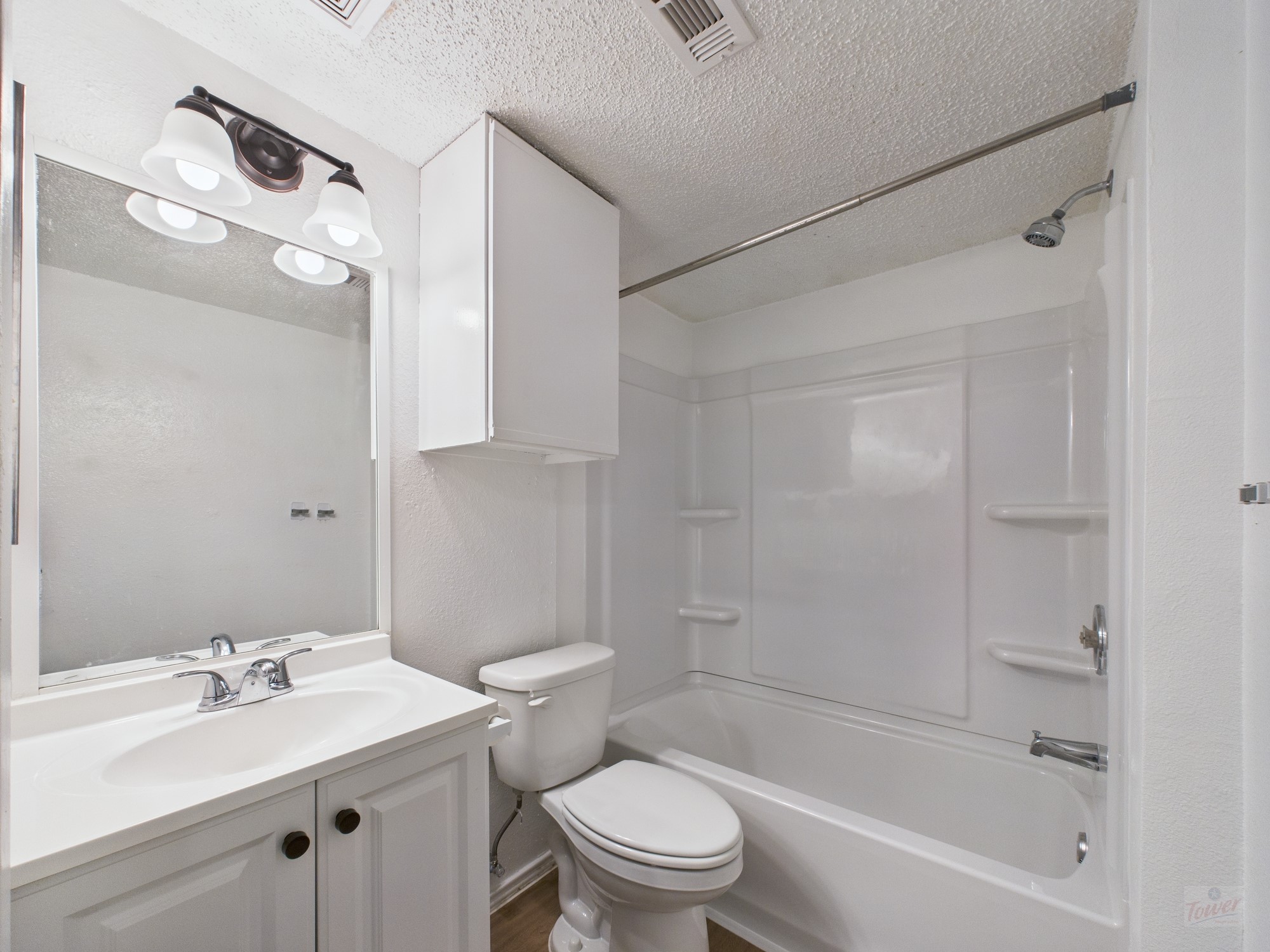 2500 Burleson Road, Unit 201 Austin, TX 78741 - Photo 15 of 20 a bathroom with a sink a toilet and shower