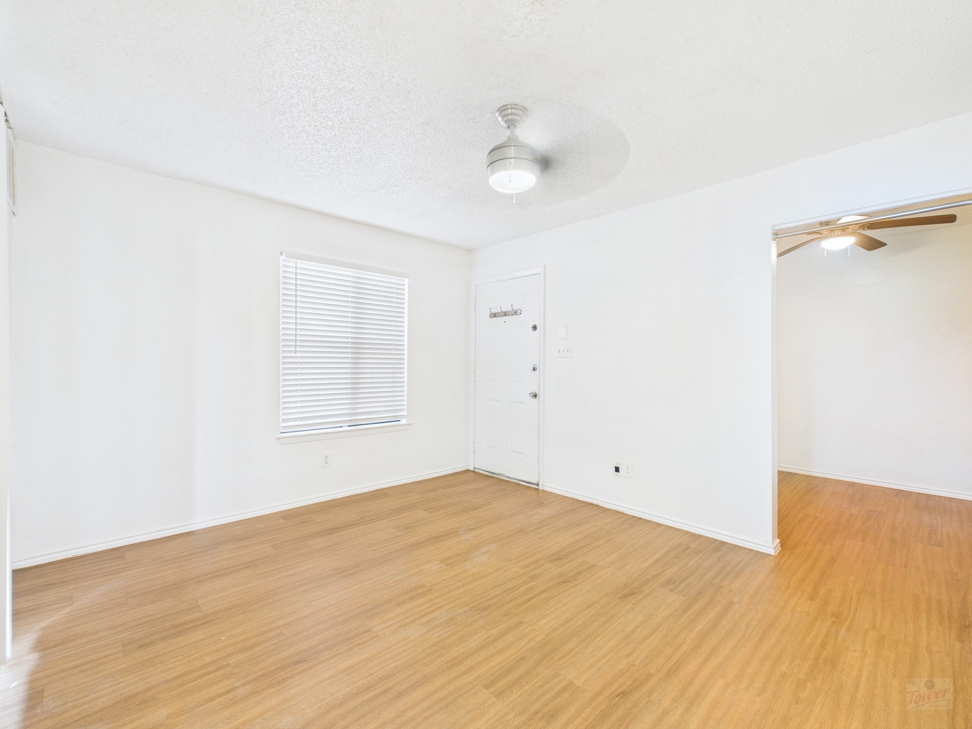 2500 Burleson Road, Unit 201 Austin, TX 78741 - Photo 5 of 20 a view of empty room with wooden floor