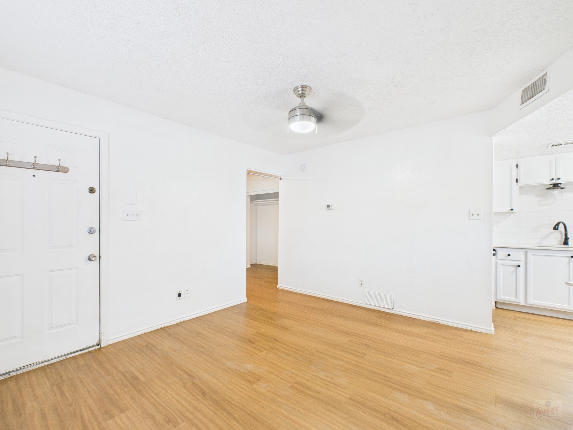 2500 Burleson Road, Unit 201 Austin, TX 78741 - Photo 6 of 20 a view of empty room with wooden floor