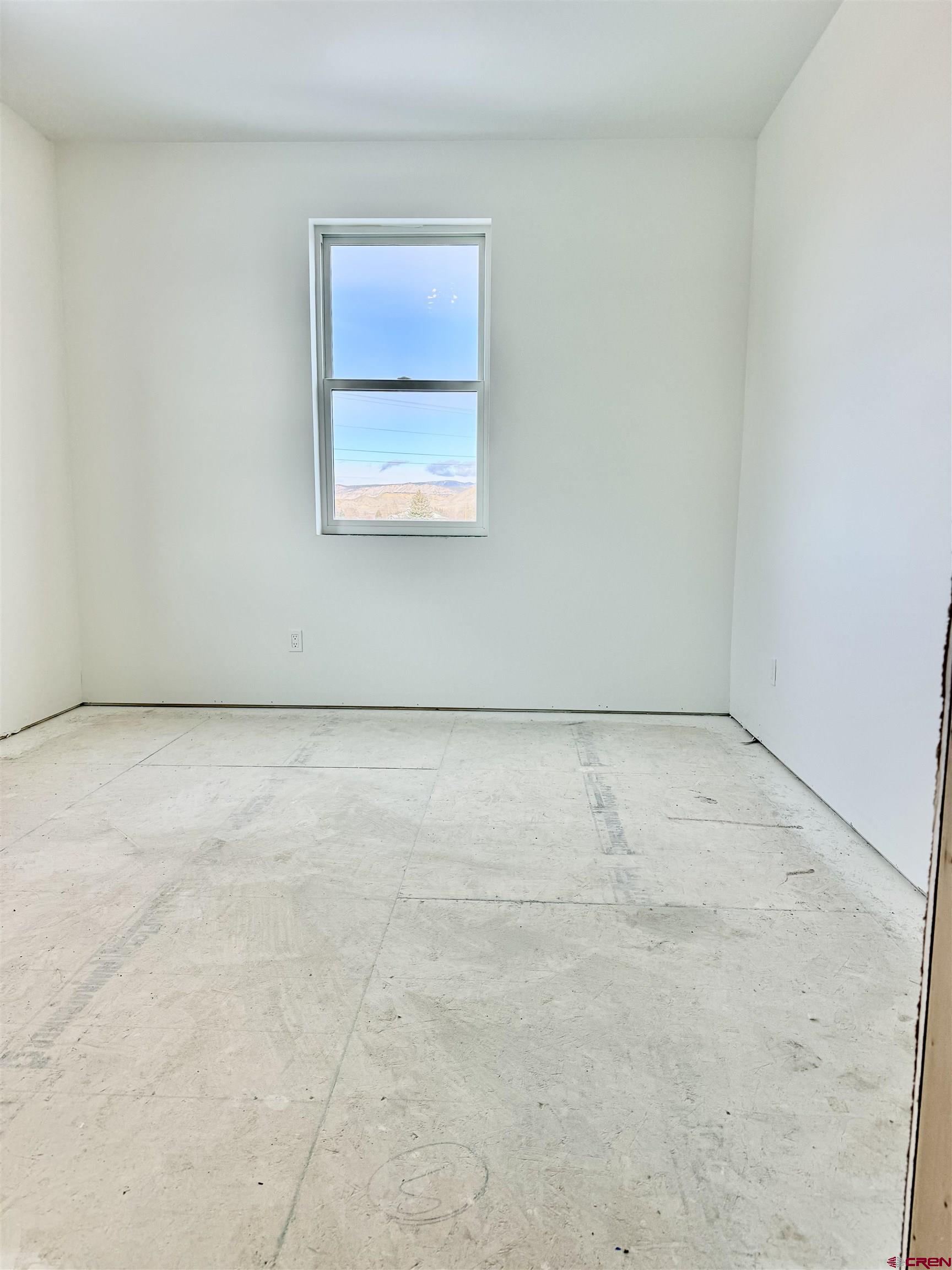 21470 Government Springs Road Montrose, CO 81403 - Photo 12 of 25 an empty room with a workbench