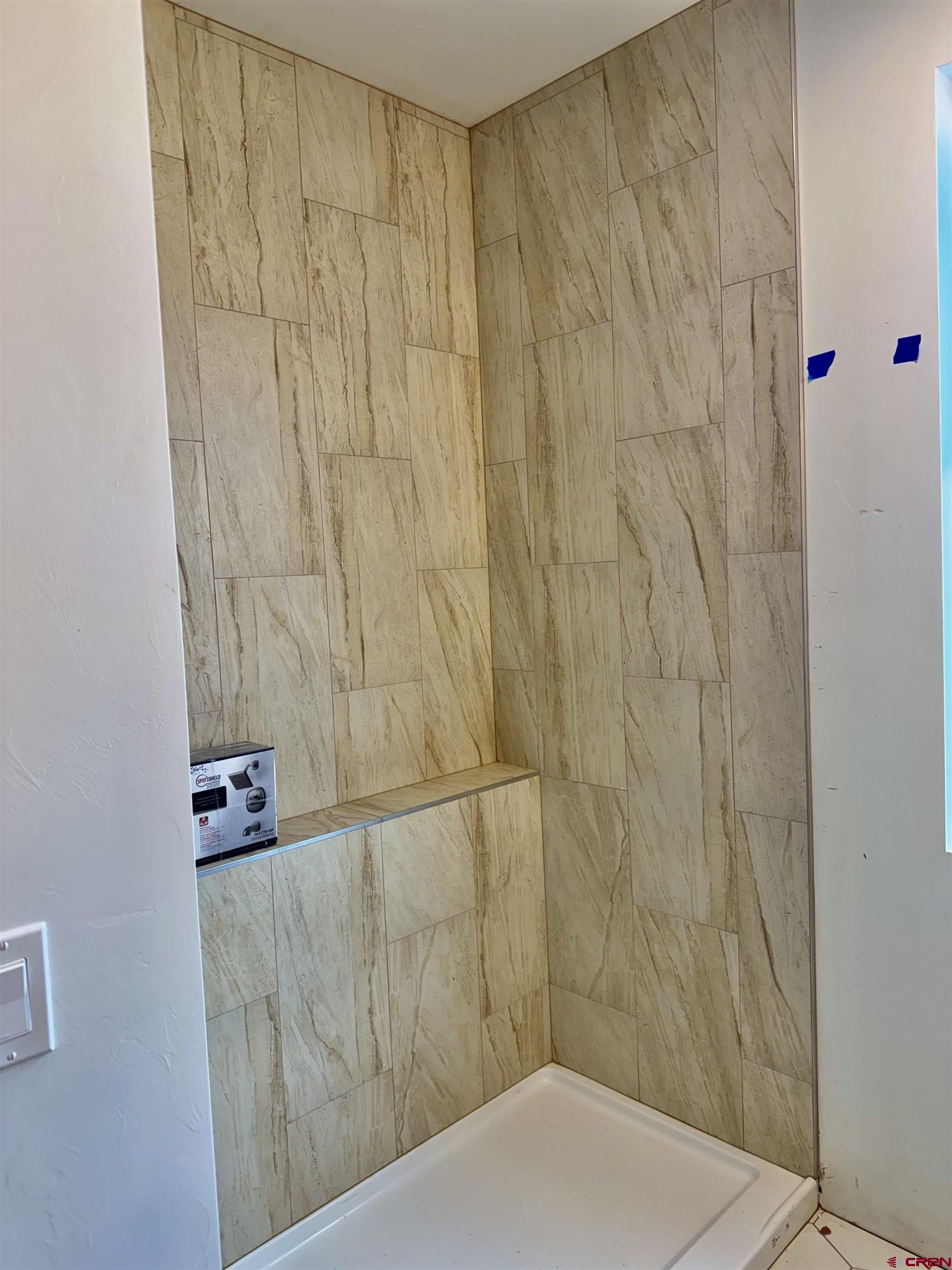 21470 Government Springs Road Montrose, CO 81403 - Photo 13 of 25 a bathroom with a shower curtain and a sink